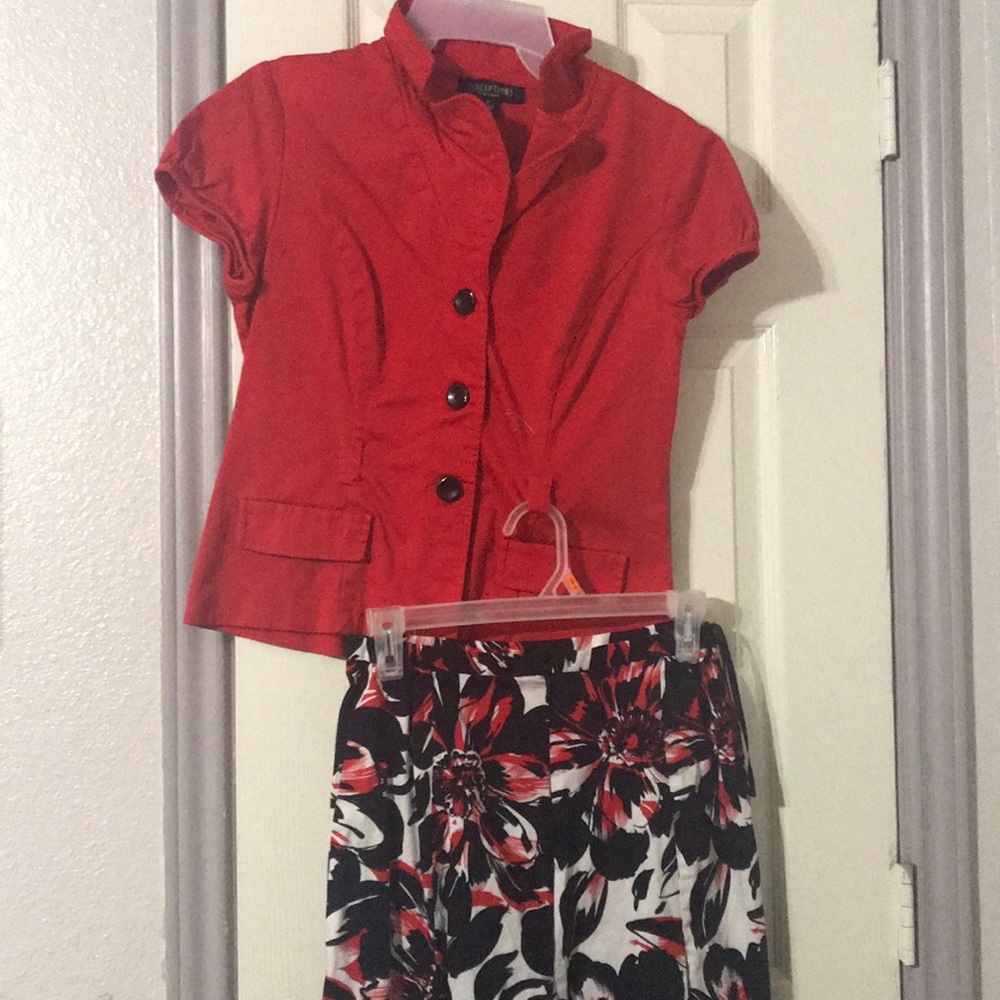 Red shirt with black white & red skirt